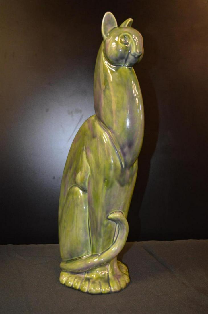 Vintage Royal Haeger Winking Cat Statue: Vintage Royal Haeger Winking Cat Statue. Stands 20 1/2" tall. The color is a bluish green. Statue has a glaze finish to it. No visible chips or marks to it.