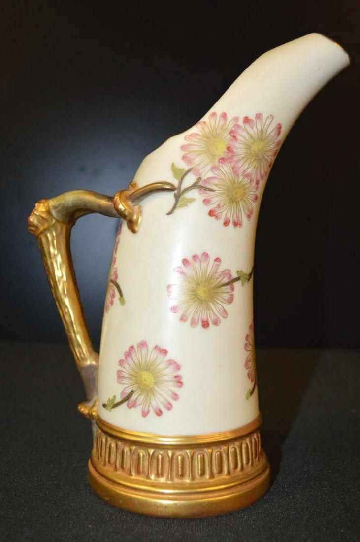 Royal Worcester Floral Pitcher Vase Stag Handle: Royal Worcester Embossed Floral Pitcher With Stag Horn Handle Circa late 1800's. #1116. A great horn or tusk vase with a floral motif with gold gilt base and handle, great condition & very attractive.