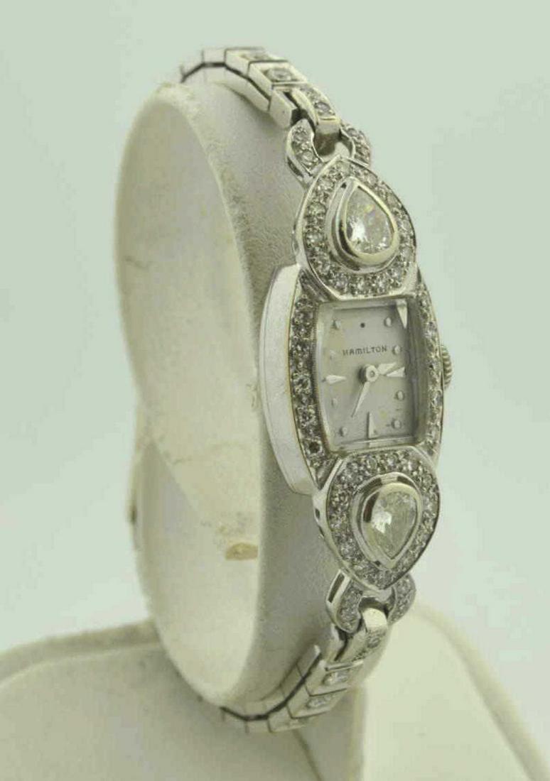 14kt white gold diamond Hamilton dress watch: Ladies 14kt white gold diamond Hamilton dress watch featuring a diamond accented case featuring bezel set pear shaped diamonds weighing approx. 0.78ct., Clarity SI2-I1, Color K. Also detailed with sin