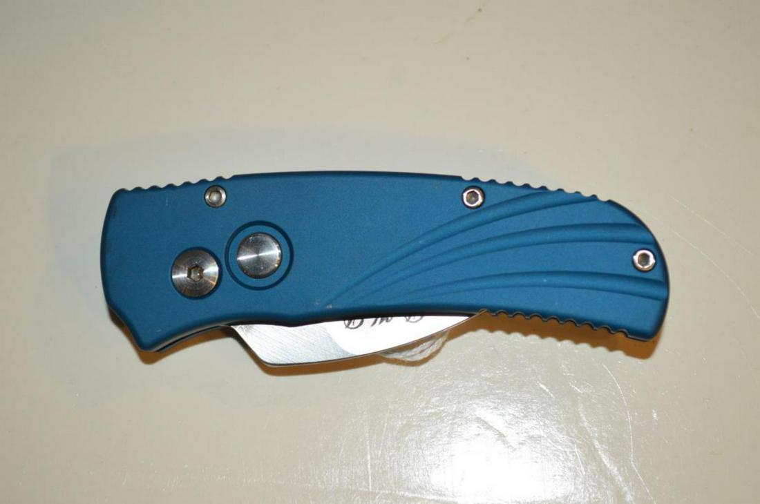 D.K.D. Shark Tooth Automatic Knife by Wayne Clark: D.K.D. Shark Tooth Automatic Knife by Custom Knife Builder Wayne Clark. Blue oversized anodized handle for a positive grip. The edge has never been used or sharpened. Chrome pocket clip. 2" blade, 5 5