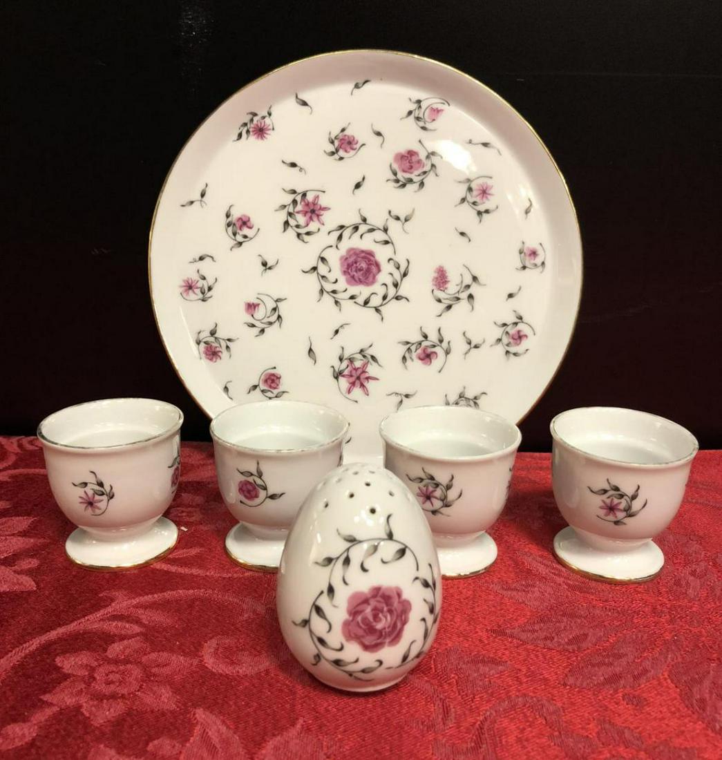 Six Piece Porcelain Egg Cup Set by EMANO: Six Piece Porcelain Egg Cup Set by EMANO includes 7.5" plate, 4 egg cups, and 1 salt shaker, all in the same pink floral design.