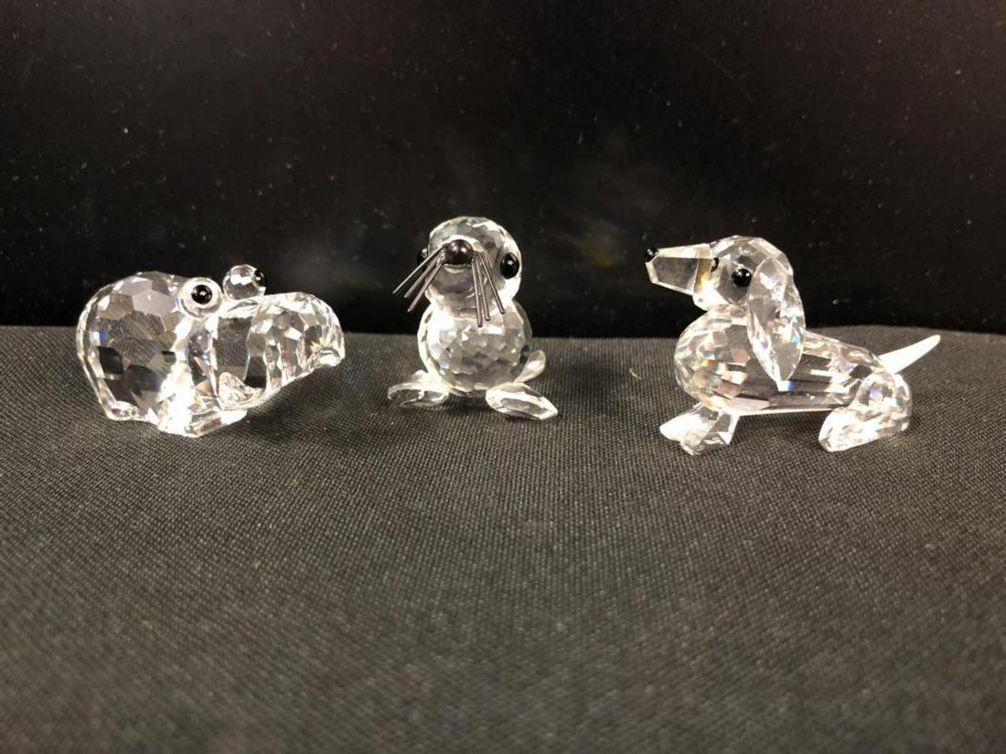 Swarovski Crystal Trio Dachshund Hippo Baby Seal: Swarovski Crystal Trio consisting of a Dachshund doggy, a Hippo, and a Baby Sealy. Classic quality collectible figurine for home & office decor. Excellent condition. Made in Austria. No tube or COA, j