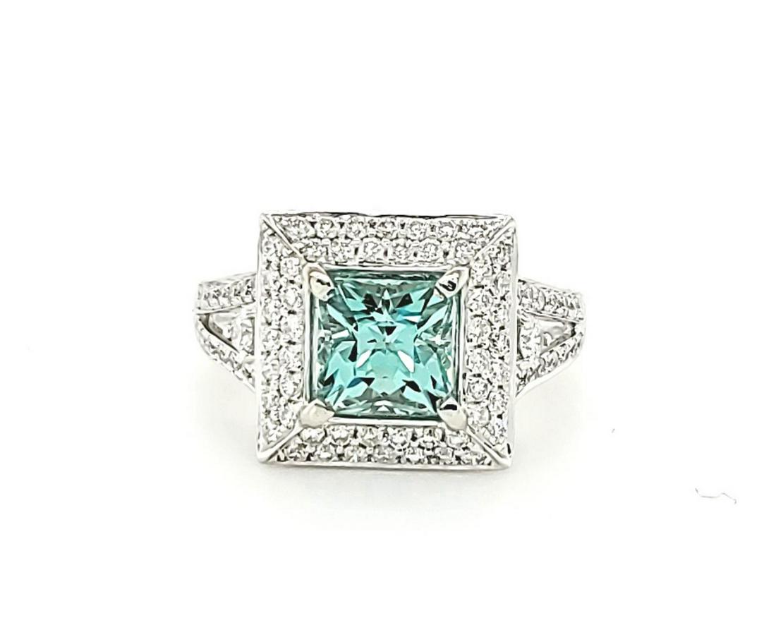 14kt white gold mint beryl and diamond ring: Ladies 14kt white gold mint beryl and diamond ring featuring set princess cut mint green beryl weighing approx. 1.45ct.. Accented with a square frame and diamond shoulders of prong set round brilliant