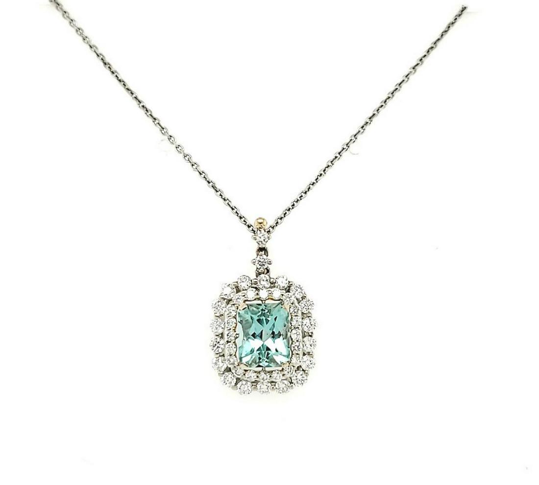 14kt white gold mint beryl and diamond pendant: Ladies 14kt white gold mint beryl and diamond pendant featuring a prong set rectangular step cut mint green beryl weighing approx. 1.56ct.. Accented with a double halo of prong set round brilliant cut