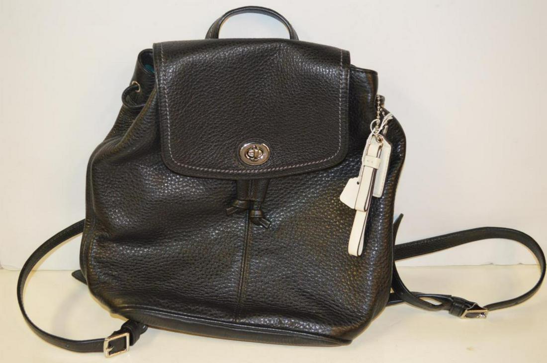Ladies Black Leather Coach Backpack D1373: Ladies Black Leather Coach Backpack Purse. Black light weight leather with black stitching, silver hardware, drawstring closure with turnkey flap, adjustable 5 hole leather strap, leather carrying han