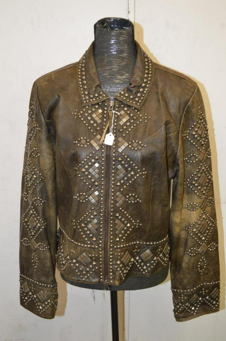 Double D Ranch Leather Jacket with Geometric Studs: Ladies Double D Ranch Leather Jacket with Geometric Studs Made in Yoakum Texas USA. Great condition ladies size L. It has a dual direction metal zipper. Fully satin lined. Bronze/brown color with mult