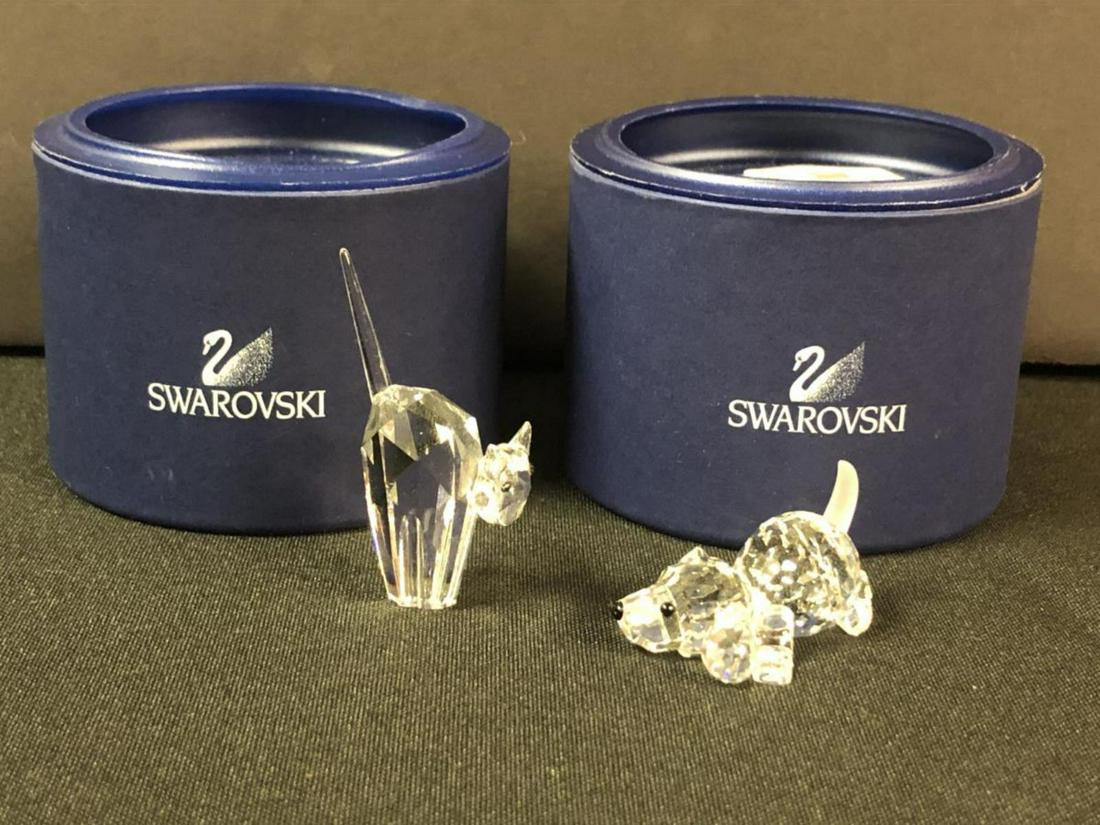 Swarovski Scared Cat & Playing Beagle w/Tube: Two different Swarovski figurines to this lot. You get Scared Cat #7634, and you getr Playing Bagle #7619. Both in tubes. Classic quality collectible figurines for home & office decor. Made in Austria