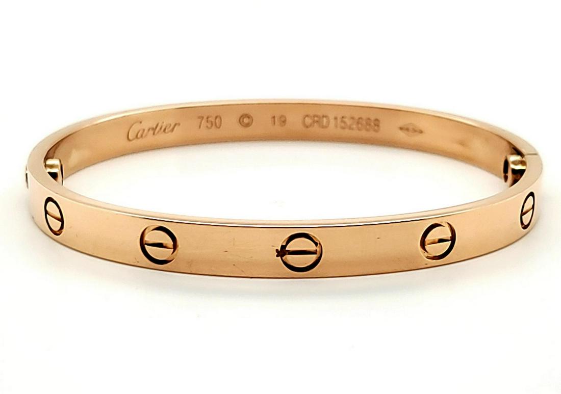 18kt rose gold Cartier Love bracelet: Ladies 18kt rose gold Cartier Love bracelet featuring the signature screw head design and screw closure. Diameter approx. 2.5". Width 6mm. Weight 35.6 grams. Does not include the screwdriver.