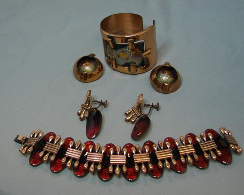 1950's Matisse Copper Jewelry Suite: Matisse copper bracelet and matching clip on earrings; red enameled bracelet, 6 1/2" long, and matching screw back dangling earrings - not marked. Both sets from the 1950's.