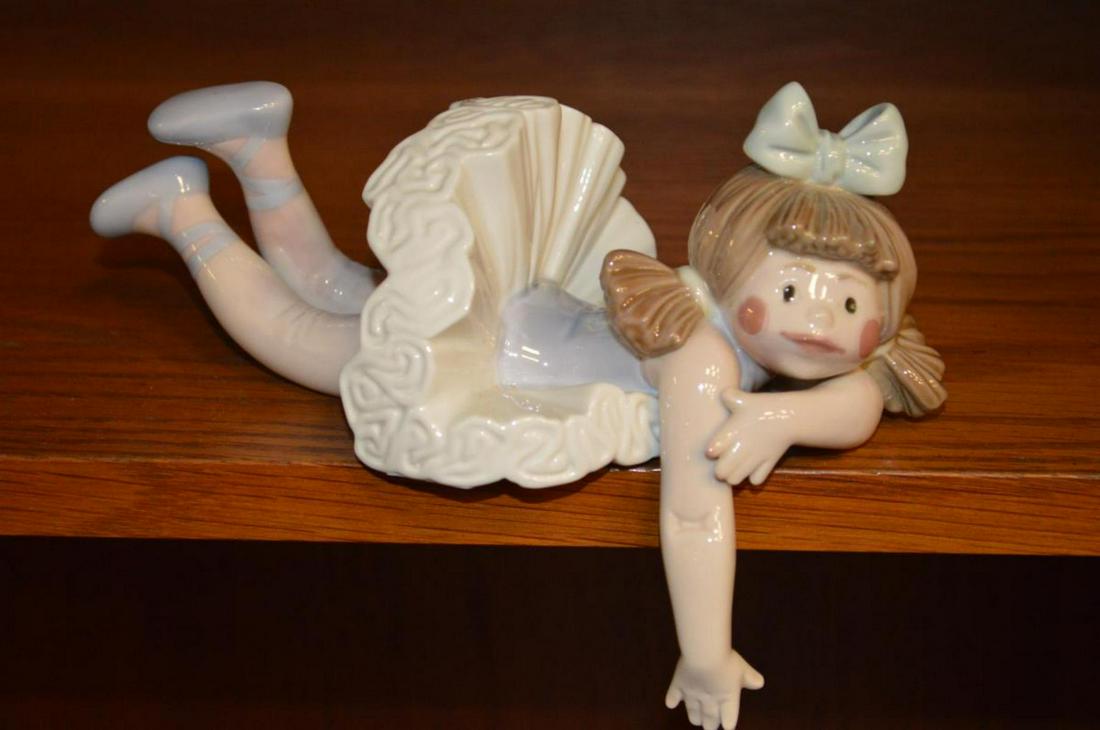 Lladro Retired Doll Figurine #1502 Forgotten: Lladro Doll Figurine #1502 Titled "Forgotten" Sculpted by Jose Puche' & release in 1986 then retired in 1991. This great doll will rest on your shelf & hang her arm over the edge. 4 3/4" from fingerti