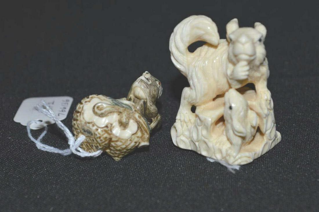 Pair of Vintage Japanese Ornately Carved Netsukes: A Pair of Vintage Japanese Ornately Carved Netsukes. These great organic or natural material netsukes are intricately carved with animal figures. Signed on undersides. This listing will include 1-Squi