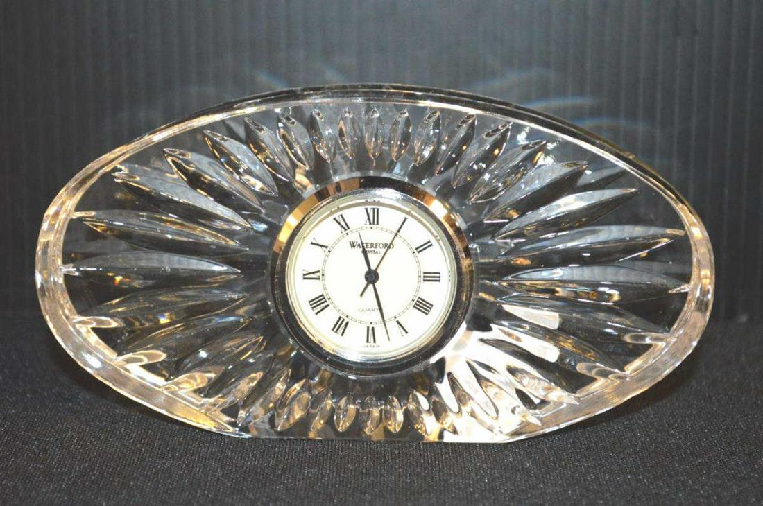 Waterford Clear Crystal Oval Desk Clock in Box: Waterford Giftware Cut Clear Crystal Oval Desk Clock in Box. Made in Ireland. Marked on the underside with an acid etched "Ireland Waterford" iconic logo. Silver tone trim on watch bezel & still has t