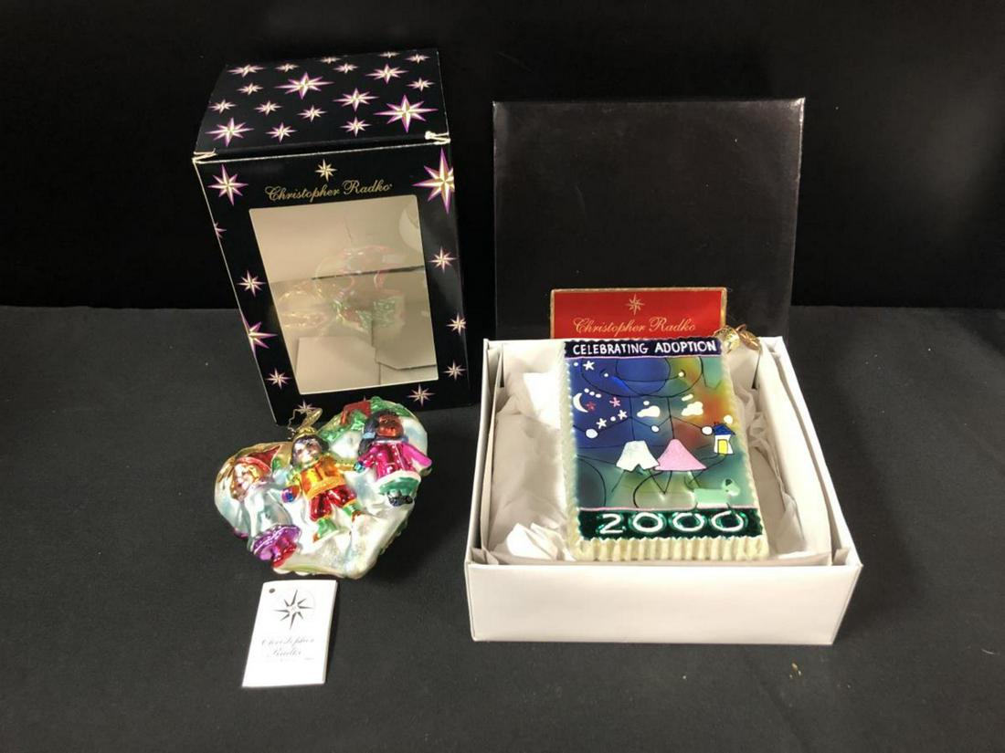Pair of Christopher Radko Adoption Ornaments: Pair of Christopher Radko Christmas Ornaments for the Dave Thomas Adoption group. Both in boxes, but one is not the original box.