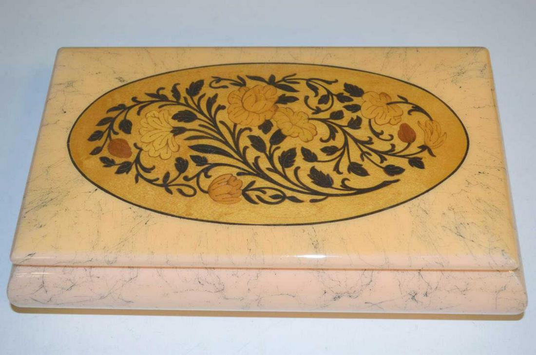 Reuge Ditalia Composite Music Box Wood Inlay Lid: Reuge Ditalia Composite Music Box with Wood Inlaid Lid. Peach colored with black splatter motif. Peach colored felt interior. Swiss movement plays "Theme from the Thorn Birds" Made in Italy. Does work