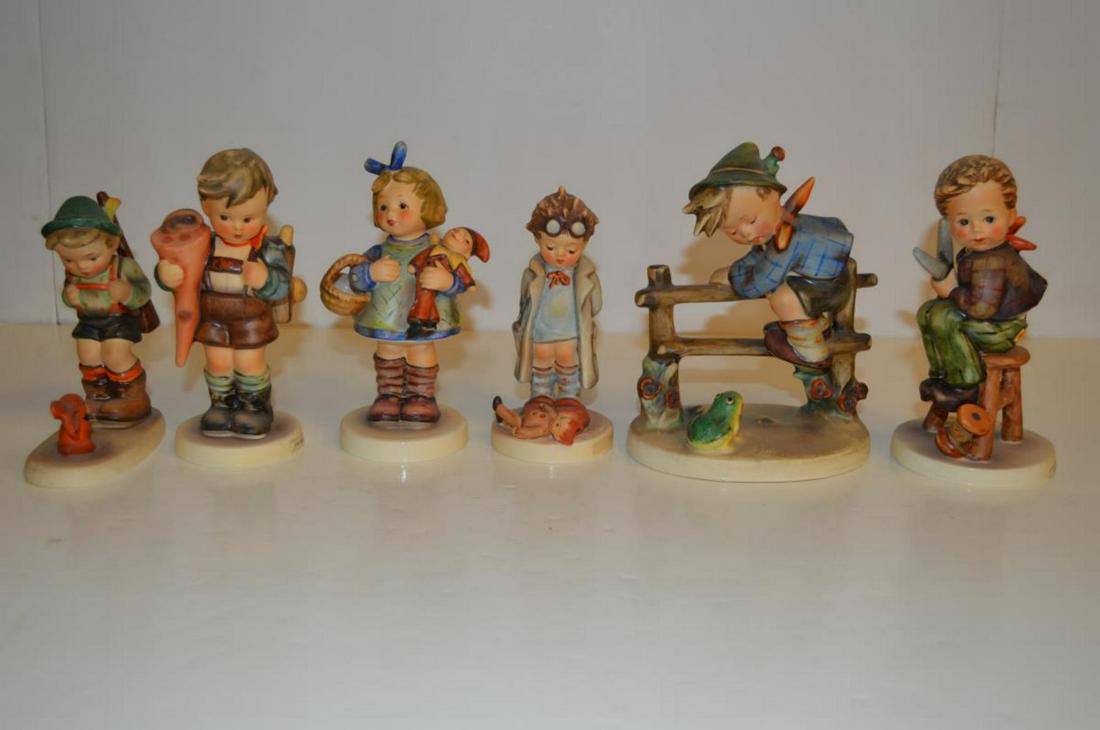 Lot Of Hummels: Lot Of Hummels. Total of 6 Hummels in the lot. Consists of Little Tailor #308 Tmk 5. Doctor #127 Tmk 5. Sensitive Hunter 6/0 Tmk 2. Little Scholar #80 Tmk 3. What now #422 Tmk 6. Retreat To Safety #20