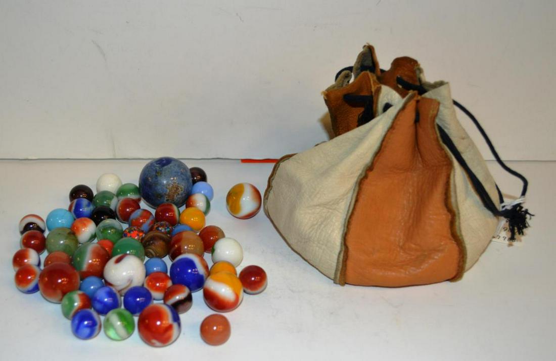 Lot of Vintage and Collectible Marbles: Lot of Vintage and Collectible Marbles in leather pouch.