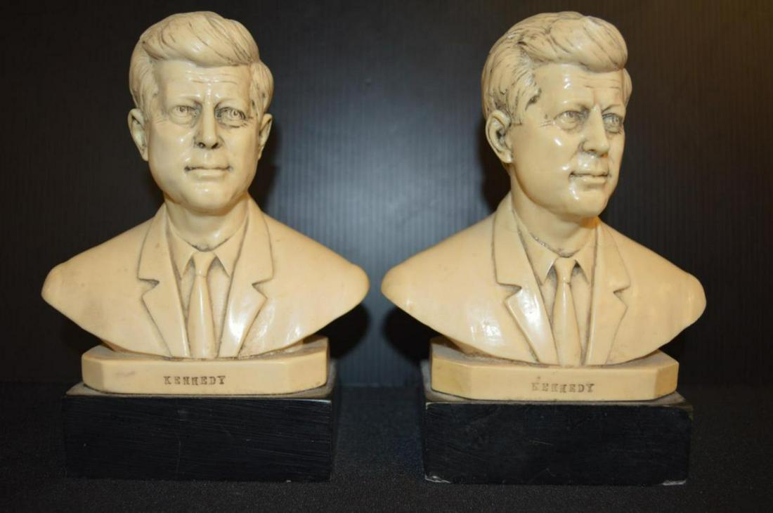 Pair Of J.F.K Alabaster Busts: Pair Of J.F.K Alabaster Busts. Stands 8" tall and measures 6" wide. Artist signature on back of the Kennedy bust. Kennedy engraved in the front. Small chips and a repair on one of the busts.