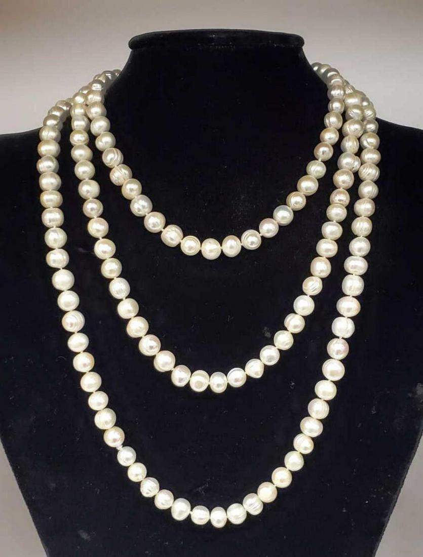 66" continuous fresh water pearl necklace: Ladies 66" continuous fresh water pearl necklace featuring single knotted 8-9mm creamy white color pearls.