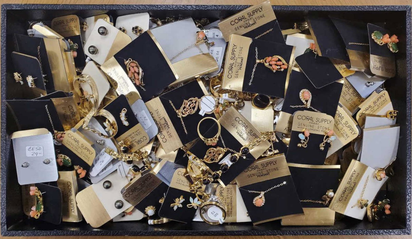 Large lot of costume jewelry: Large lot of costume jewelry including pearl bracelets, colored stone rings, carved coral pendant, cross pendants, Pearl dangle earrings, colored stone bracelets, men's rings, colored stone stud earri