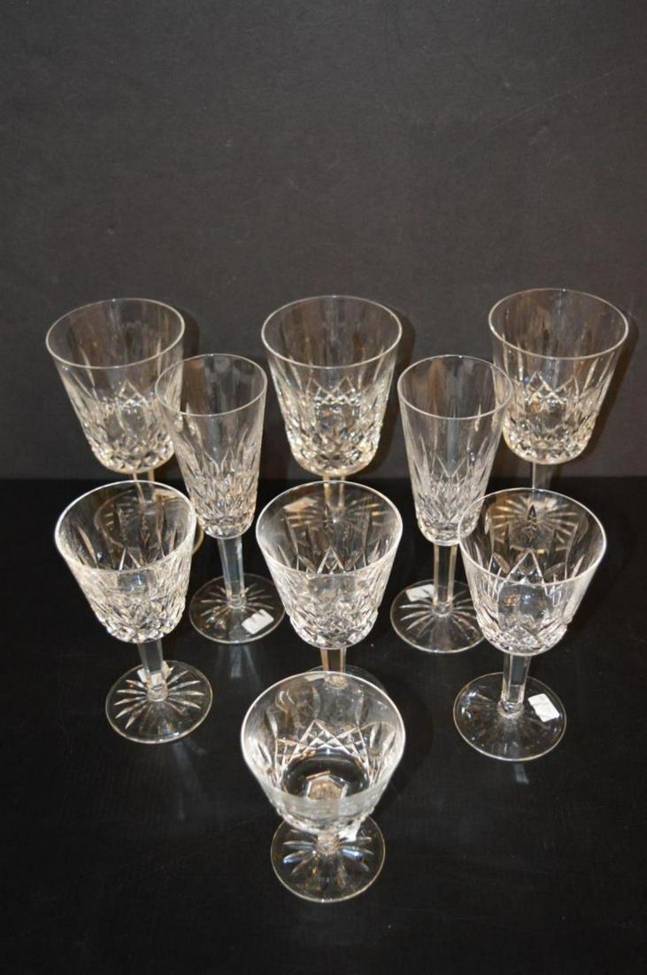 Lot Of Waterford Lismore Pattern Wine Glass: Lot Of Waterford Lismore Pattern Wine Glass. Total of 9 Waterford glasses in the lot. Consists of 2 champagne flute standing 7 1/4" tall. 3 red wine glasses standing 7" tall. Chips on all 3 of them. 3