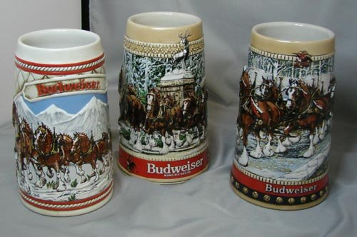 3 Budweiser Steins & Franklin Mint Rolls Royce: 3 Budweiser steins - A series 1985, Collector's series 1988, and C series Clydesdales parading through Anheuser Busch gate; no chips or cracks, also a Franklin Mint Rolls Royce, a few pieces fell off 