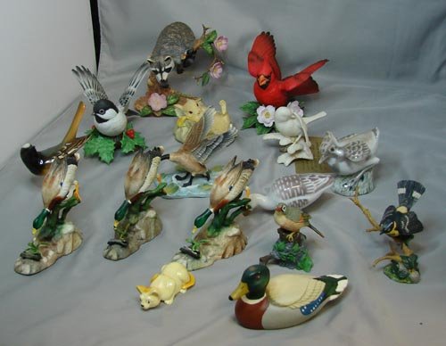 Lot of figurines, mostly birds Lenox: Lot of figurines including a cardinal, chickadee & raccoon made by Lenox, a Hutschenreuther dove, 2 Bing & Grondal birds, Goebel bird, 6 heavy metal birds, small cat, Aynsley rabbit, Avon duck