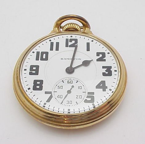 Hamilton open face pocket watch: 10K gold filled gent's open face "railroad" style Hamilton pocket watch weighing 100.2 grams. The watch has a hand wind jeweled movement and a white enamel face, Arabic numerals and circular second ha