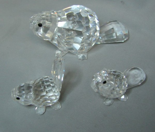 Lot of 3 Swarovski Beavers - Mother & 2 babies: Lot of 3 Swarovski crystal beavers - mother beaver and lying down baby and sitting up baby, all with original boxes and packing. No chips or cracks.