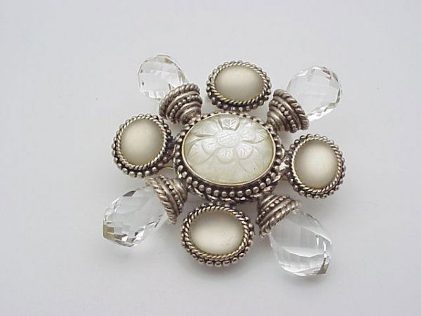 Stephen Dweck sterling moonstone pin: Exquisite Stephen Dweck ornate floral pin weighing 68.4 grams. This beautiful pin contains oval moonstone and briolette white topaz with carved stone in middle.
