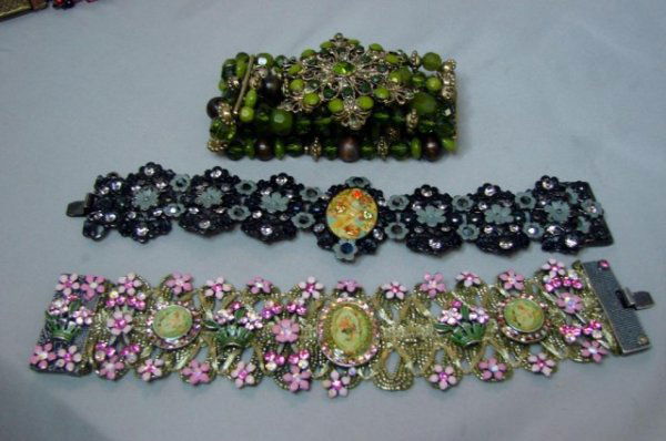 3 Designer Costume Bracelets Signed MX: Lot of 3 designer bracelets, the black and pink crystal and flower beaded bracelets are signed MX, the 5 strand green stretch beaded bracelet is unsigned