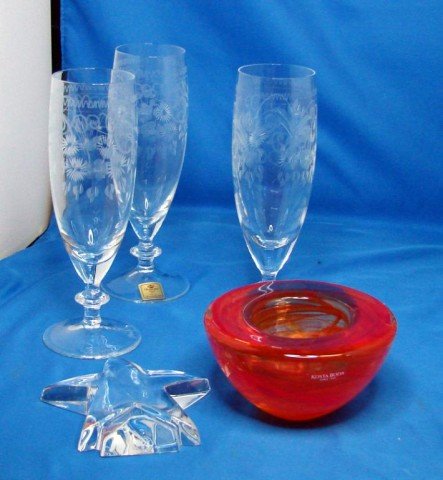 Lot of crystal: Baccarat star, Kosta Boda bowl: Baccarat crystal star 4", 3 German etched crystal champagne flutes, new with stickers, orange Kosta Boda bowl 4 1/2" dia., no chips or cracks, and a vintage clothes brush/sewing kit.