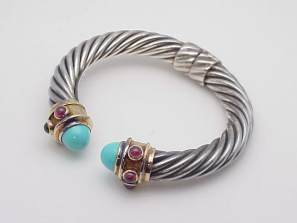 David Yurman design sterling 14ky and bullet shap: David Yurman design sterling 14ky and bullet shaped turquoise with pink tourmaline has ropetwist design and spring mechanism.