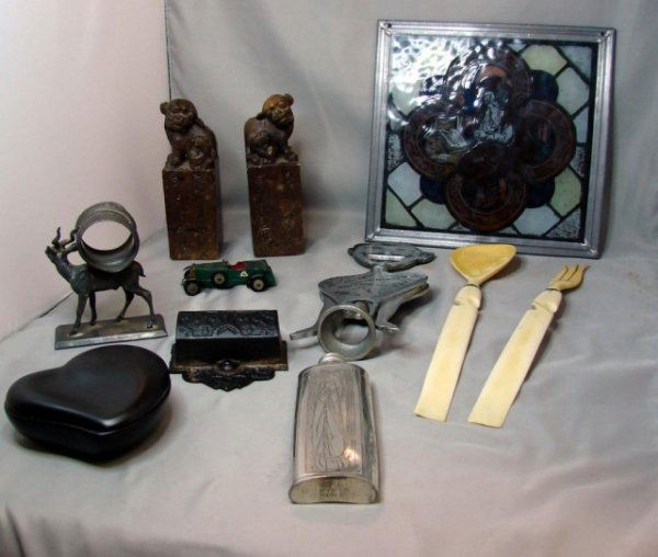 Vintage lot: Foo dogs, pewter napkin ring, flask +: Box lot consisting of 12" ivory fork & spoon, marble foo dog chops 6", antique pewter napkin ring holder, vintage McIntosh pocket flask, toothpick holder, 1929 Bentley by Lesney, Tiffany ceramic heart