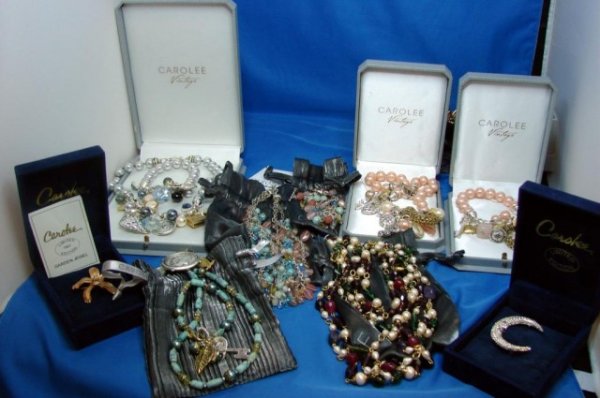 12 Pieces Carolee Jewelry, vintage beads, etc.: 3 sets of Carolee Vintage necklaces with matching bracelets in original boxes, orchid pin and crescent moon pin in boxes, 2 beaded necklaces with matching bracelets in pleated silk pouches, 1 multicol