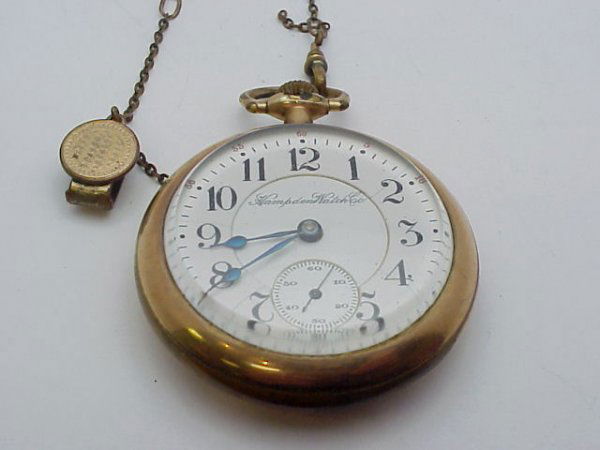 21 jewel Hampden pocket watch: Men's Hampden 21jewel pocket watch, open face with second hand gold-filled with fob. Watch in good working condition.