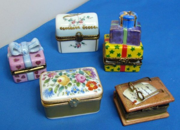 5 Limoges boxes: presents, flowered trunk, book: Lot of 5 Limoges Porcelain Boxes, all signed, tallest approximately 2 1/4" tall; no chips or cracks.