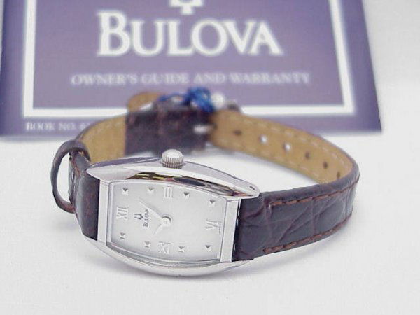 Lady's Bulova designer watch with mother of pearl: Lady's Bulova designer watch has mother of pearl roman dial and genuine leather band. IT'S NEW!
