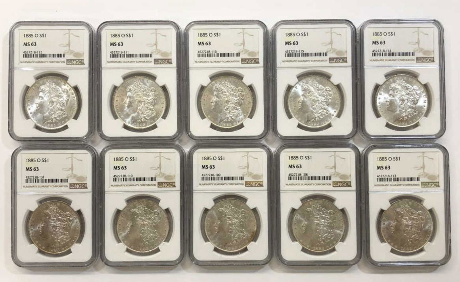 Dealer Lot of 10 1885-O Morgan Silver $1 NGC MS63 (1 of 2)