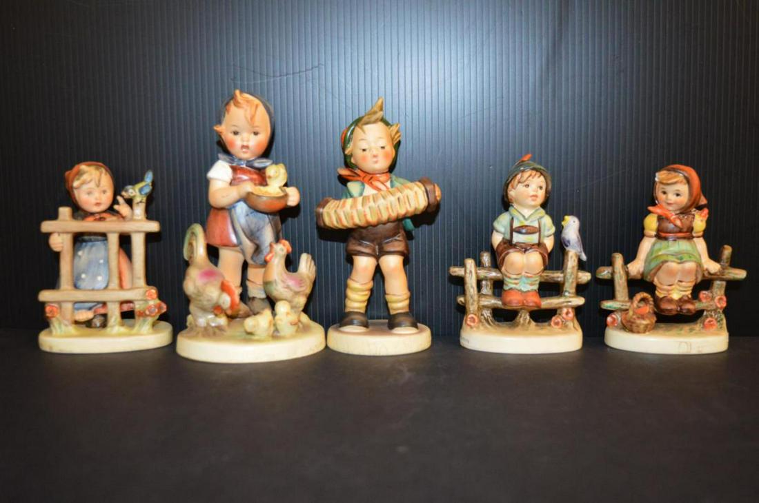 Five Hummels: Five Hummels. Two with the earlier mark, one has a glaze chip, 4" to 4 3/4"h.