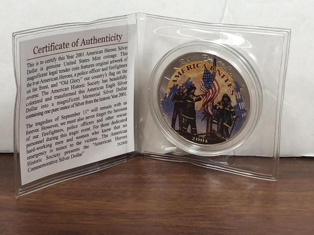 2001 Silver Eagle Colorized American Heroes: 2001 Silver Eagle Colorized In commemoration of the Firefighters, American Heroes. for the September 11 Tragedy. Obverse features firefighters raising an American Flag, and the reverse features the si