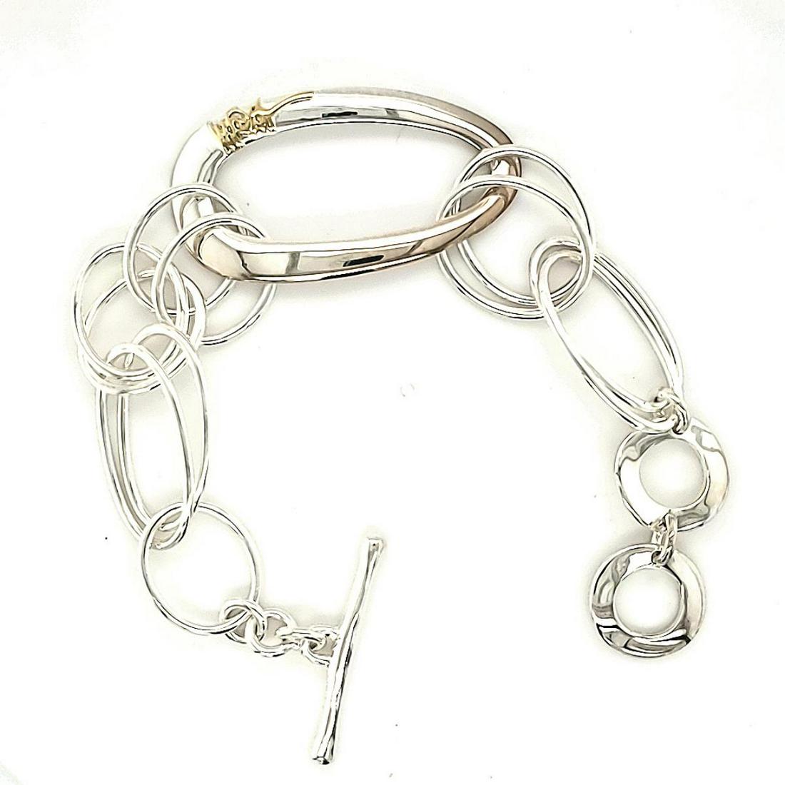 Ippolita Sterling &18k Classico Scultura Bracelet: Ladies sterling silver Ippolita Classico Scultura bracelet featuring large oval links and finished with a toggle clasp. Detailed with Ippolita's signature in gold. Length approx. 8". Weight 26.8 grams