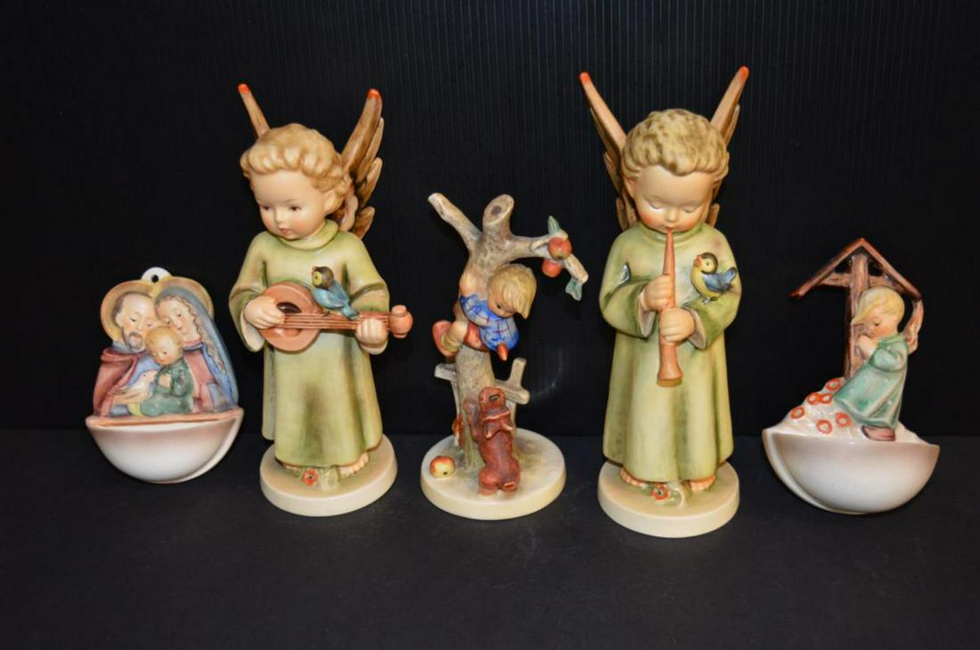 Five Hummels: Five Hummels. Including two angels and two wall pockets, 4 1/4" to 8 1/4"h.