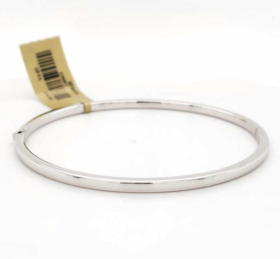 18kt white gold Roberto Coin bangle bracelet: Ladies 18kt white gold Roberto Coin bangle bracelet . Width 2mm. Measures 2.5" in diameter. Weight 6.2 grams. Comes with the original box.