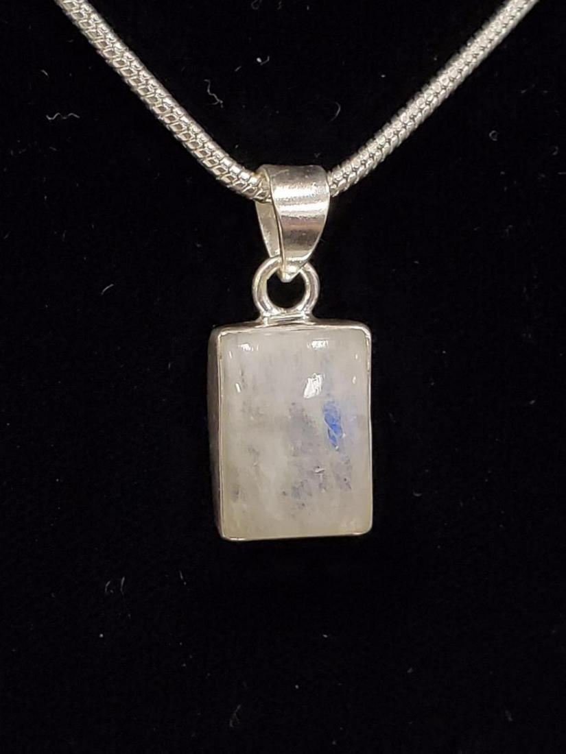 Sterling Silver moonstone pendant: Ladies sterling silver moonstone pendant featuring a rectangular cabochon cut moonstone measuring 11x14mm. Hanging from a 20" chain. Weight 11.1 grams.TH-700300