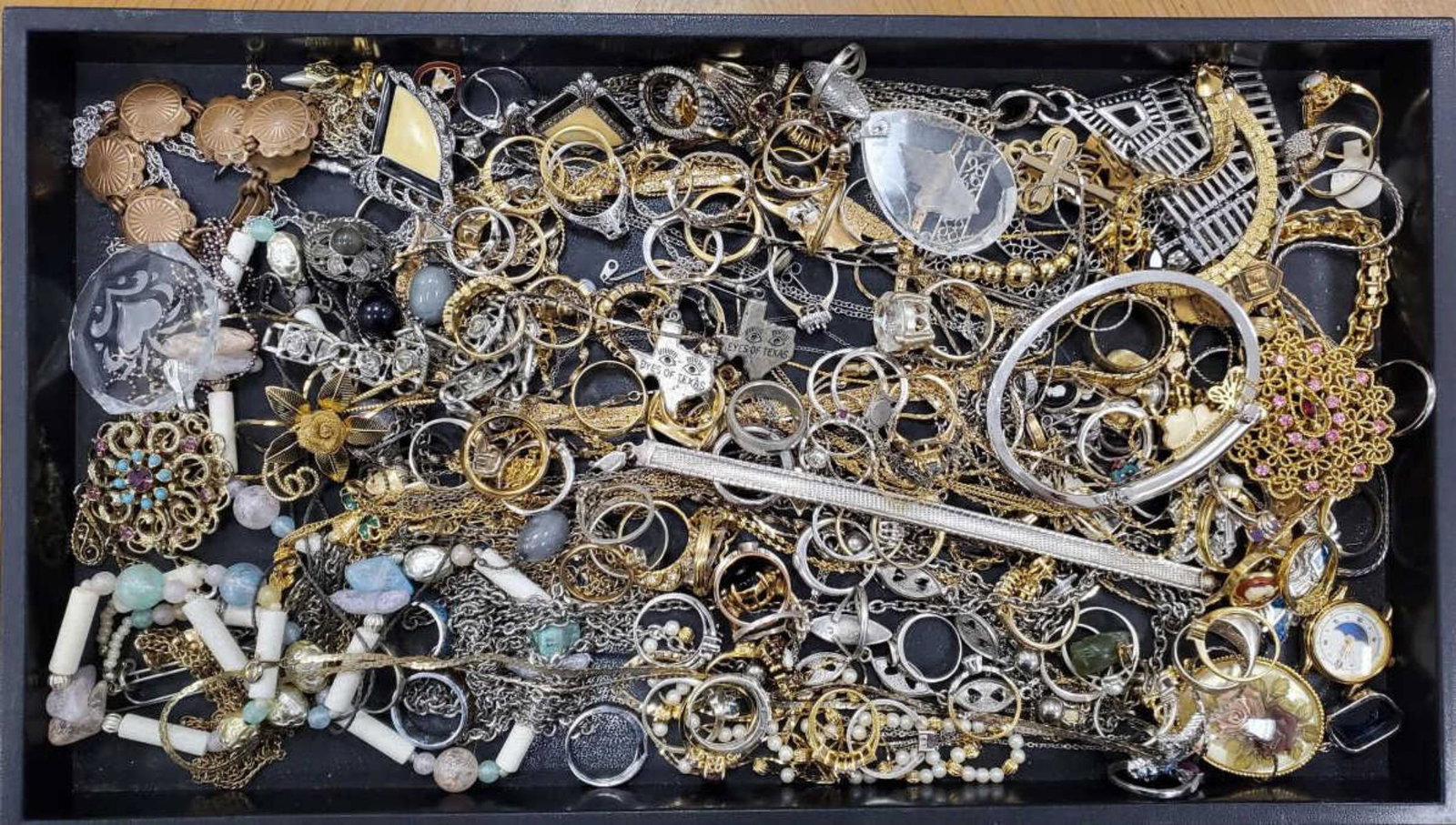 Lot of costume jewelry: Lot of costume jewelry including fashion bands, colored stone rings, brooches, large pendants, bracelets, fancy link chains and more.