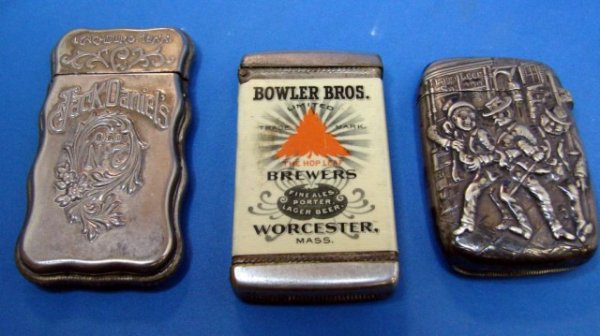 Vintage Lot of 3 Match Holders Safes - 1 is Gorham: 3 antique match holders or match safes, one marked Bowler Bros. Brewers, Worcester Mass, one Jack Daniels Lynchburg, Tenn., and one depicting 3 old sots, made in Pawtucket, R.I., and marked Gorham Co.
