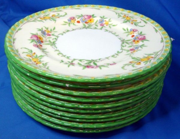 10 Antique Minton Dessert or Salad Plates: 10 Antique Minton Dessert or Salad Plates, 8" diameter, with a floral design and green painted rim; some slight glaze flecks on a few of the rims;