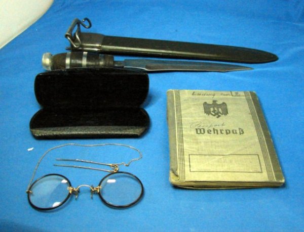 WWII Dagger, Nazi Passport, Vintage Eyeglasses: Lot consisting of a WW II dagger, a Nazi passport with some papers inside, mostly in German, with some English translation, and a pair of vintage eyeglasses with case.