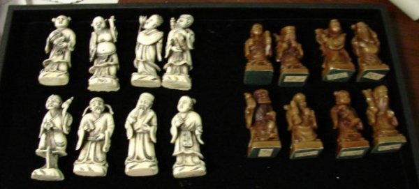 Chinese figurines - 8 Immortals (2 sets): 2 sets of Chinese "8 Immortals"; not sure of composition; light colors may be whale ivory or bone (not plastic); darker colors are a composition material. 3" tall.