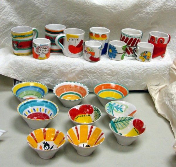 19 pcs. DeSimone Pottery Cups & Bowls: 19 pcs. DeSimone Pottery - 6 large mugs, 4 small demitasse cups, 4 bowls in 5" & 6" dia. Individually hand crafted and hand painted with unleaded colors, De Simone pottery adds cheerful flair and styl